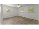 Bright bedroom featuring hardwood floors, white walls, and a ceiling fan for optimal comfort at 2711 Bethesda Ne Ct, Lawrenceville, GA 30044
