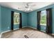 Bedroom featuring hardwood floors and windows for natural light at 2711 Bethesda Ne Ct, Lawrenceville, GA 30044
