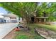 View of home with lawn, driveway, a white garage and porch swing on the side at 2711 Bethesda Ne Ct, Lawrenceville, GA 30044