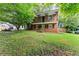 Charming two-story brick home with a second-floor balcony and a spacious front yard at 2711 Bethesda Ne Ct, Lawrenceville, GA 30044
