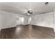 Open-plan living room with wood-look floors and painted brick walls at 2711 Bethesda Ne Ct, Lawrenceville, GA 30044