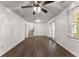The living room features wood-look floors, access to the staircase, and glass doors at 2711 Bethesda Ne Ct, Lawrenceville, GA 30044