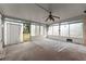 Enclosed sunroom with concrete flooring and large windows leading to the backyard at 2711 Bethesda Ne Ct, Lawrenceville, GA 30044