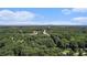 Scenic aerial shot overlooking verdant tree canopy with homes scattered throughout the lush landscape at 3440 Oaktree Way, Stonecrest, GA 30038