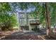 Back exterior with garage, deck and a spacious backyard at 3440 Oaktree Way, Stonecrest, GA 30038