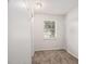Walk-in closet with neutral carpet, wire shelving, and a window providing natural light at 3440 Oaktree Way, Stonecrest, GA 30038