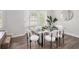 Bright dining area featuring a glass table, modern chairs, and ample natural light at 3440 Oaktree Way, Stonecrest, GA 30038