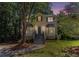 Charming two-story brick home with bay windows, fresh landscaping, and a welcoming staircase at 3440 Oaktree Way, Stonecrest, GA 30038