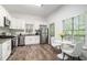 Updated kitchen with stainless steel appliances, granite countertops, and a cozy breakfast nook at 3440 Oaktree Way, Stonecrest, GA 30038