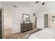 Spacious main bedroom featuring vaulted ceiling, ceiling fan, walk-in closet, and modern decor at 3440 Oaktree Way, Stonecrest, GA 30038