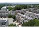 Stunning aerial view of a residential area with townhomes featuring rooftop decks and solar panels at 1066 Brandsford Nw St, Atlanta, GA 30318