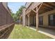 View of the backyard and deck featuring green grass and a wooden privacy fence at 1066 Brandsford Nw St, Atlanta, GA 30318
