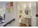 Charming half-bath features a pedestal sink, and a decorative mirror at 1066 Brandsford Nw St, Atlanta, GA 30318