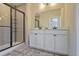 Bathroom showcasing a double sink vanity with modern fixtures and a separate tiled shower at 1066 Brandsford Nw St, Atlanta, GA 30318