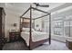 Comfortable bedroom features a four-poster bed, neutral decor, and great natural light at 1066 Brandsford Nw St, Atlanta, GA 30318