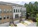Charming two-story townhomes with brick and siding, garages, and landscaped front yards at 1066 Brandsford Nw St, Atlanta, GA 30318