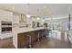Beautiful kitchen with oversized island, quartz countertops, stainless steel appliances, and hardwood floors at 1066 Brandsford Nw St, Atlanta, GA 30318