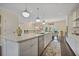 Bright eat-in kitchen features a large island, stainless appliances, and pendant lighting at 1066 Brandsford Nw St, Atlanta, GA 30318