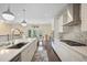 Eat-in kitchen features stainless appliances, a breakfast nook, tile backsplash and hardwood floors at 1066 Brandsford Nw St, Atlanta, GA 30318