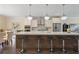 Kitchen with an island featuring bar stool seating, stainless steel appliances, and hardwood floors at 1066 Brandsford Nw St, Atlanta, GA 30318