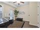 Beautiful living room with gleaming wood floors, grand piano, and a glass paneled exterior door at 1066 Brandsford Nw St, Atlanta, GA 30318