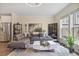 Cozy living room with hardwood floors, neutral decor, and a comfortable sectional sofa at 1066 Brandsford Nw St, Atlanta, GA 30318