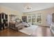 Spacious living room with ample natural light, a plush sofa, and hardwood floors at 1066 Brandsford Nw St, Atlanta, GA 30318