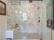 Luxurious marble walk-in shower with a rainfall shower head and built-in bench at 1066 Brandsford Nw St, Atlanta, GA 30318