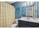 This bathroom features a stylish vanity and shower with an artistic shower curtain at 2084 Del Lago Nw Cir # 1, Kennesaw, GA 30152