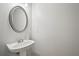 This bathroom features a modern sink, vanity, and large mirror at 2084 Del Lago Nw Cir # 1, Kennesaw, GA 30152
