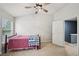 Relax in this cozy bedroom with a ceiling fan and convenient access to the upper level at 2084 Del Lago Nw Cir # 1, Kennesaw, GA 30152