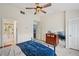 Bright bedroom offers great closet space, a ceiling fan, and direct access to the bathroom at 2084 Del Lago Nw Cir # 1, Kennesaw, GA 30152