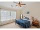 A cozy bedroom offers carpeted floors, neutral tones, and ample natural light, creating a serene atmosphere at 2084 Del Lago Nw Cir # 1, Kennesaw, GA 30152