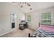 This bedroom features a desk area, a ceiling fan, and an ensuite bathroom at 2084 Del Lago Nw Cir # 1, Kennesaw, GA 30152