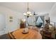 Bright and airy dining area with hardwood floors adjacent to living room at 2084 Del Lago Nw Cir # 1, Kennesaw, GA 30152