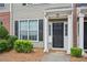 Inviting entrance with a classic black door and manicured shrubbery at 2084 Del Lago Nw Cir # 1, Kennesaw, GA 30152