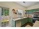 A kitchen area features an exterior door to the backyard and stainless steel appliances with open shelving at 2084 Del Lago Nw Cir # 1, Kennesaw, GA 30152