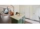 A kitchen island featuring granite countertops offers prep space and storage, seamlessly connecting to a spacious living area at 2084 Del Lago Nw Cir # 1, Kennesaw, GA 30152