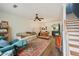 Bright living room with hardwood floors, ceiling fan, and staircase at 2084 Del Lago Nw Cir # 1, Kennesaw, GA 30152