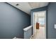 A landing features blue walls and trim with a bedroom visible through an open doorway at 2084 Del Lago Nw Cir # 1, Kennesaw, GA 30152