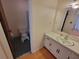 Well-lit bathroom featuring a vanity with sink and adjacent toilet area, offering a clean and functional space at 2206 Rhett Ct, Lawrenceville, GA 30044