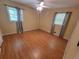 Inviting bedroom with hardwood floors, large windows, ceiling fan, and neutral color scheme at 2206 Rhett Ct, Lawrenceville, GA 30044