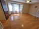 Bright bedroom with hardwood floors, natural lighting, and modern ceiling fan, offering a comfortable and relaxing space at 2206 Rhett Ct, Lawrenceville, GA 30044