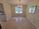 Bright dining room with a chandelier and large windows at 2206 Rhett Ct, Lawrenceville, GA 30044