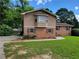 Charming brick home with a well-maintained lawn and inviting curb appeal at 2206 Rhett Ct, Lawrenceville, GA 30044