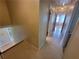 Hallway features tiled floors and multiple doorways, providing easy access to other areas of the home at 2206 Rhett Ct, Lawrenceville, GA 30044