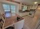 Bright kitchen featuring white cabinets, granite countertops, and tile flooring, offering a functional and stylish cooking space at 2206 Rhett Ct, Lawrenceville, GA 30044