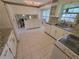 Well-lit kitchen featuring granite counters, white cabinets and modern appliances at 2206 Rhett Ct, Lawrenceville, GA 30044