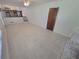 Open-concept living area adjacent to the kitchen, featuring tile floors and natural light, perfect for entertaining at 2206 Rhett Ct, Lawrenceville, GA 30044