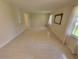 Bright living room with neutral tile floors and large windows at 2206 Rhett Ct, Lawrenceville, GA 30044